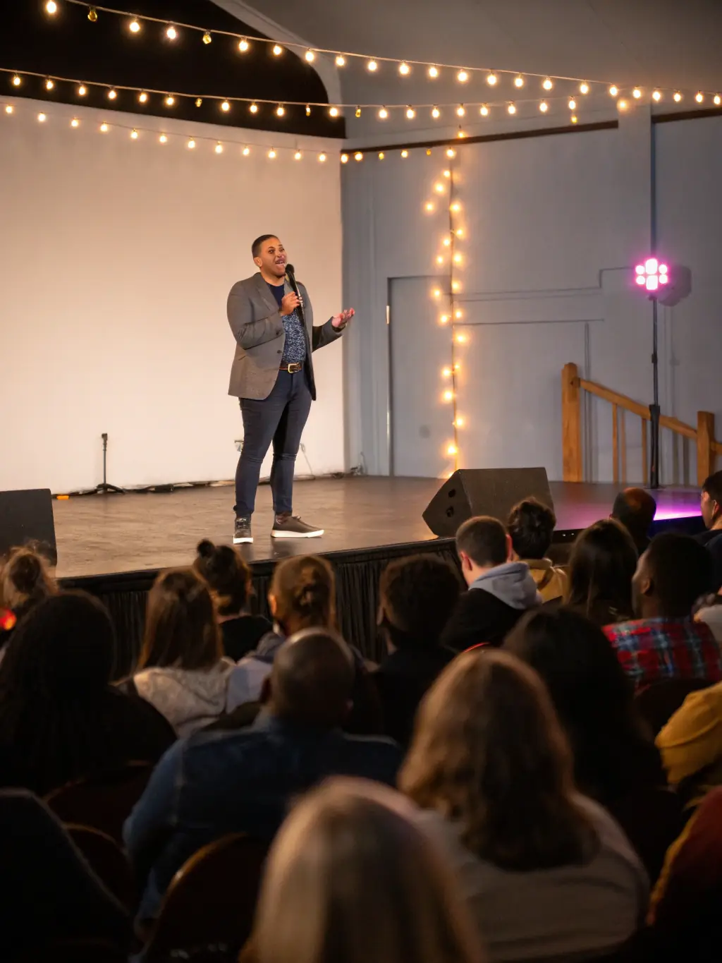 A photograph capturing the keynote speaker delivering an inspiring speech at the Corporate Innovation Conference, with the audience listening attentively.
