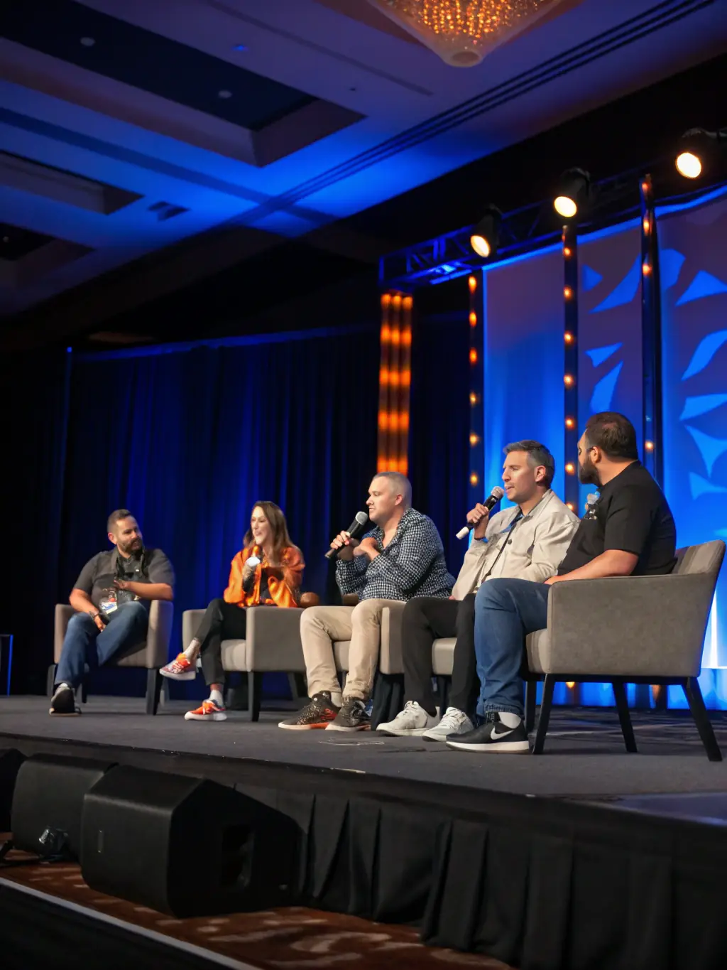 A vibrant image of a panel discussion at the conference, featuring industry leaders engaging in a lively debate on innovation challenges and opportunities.